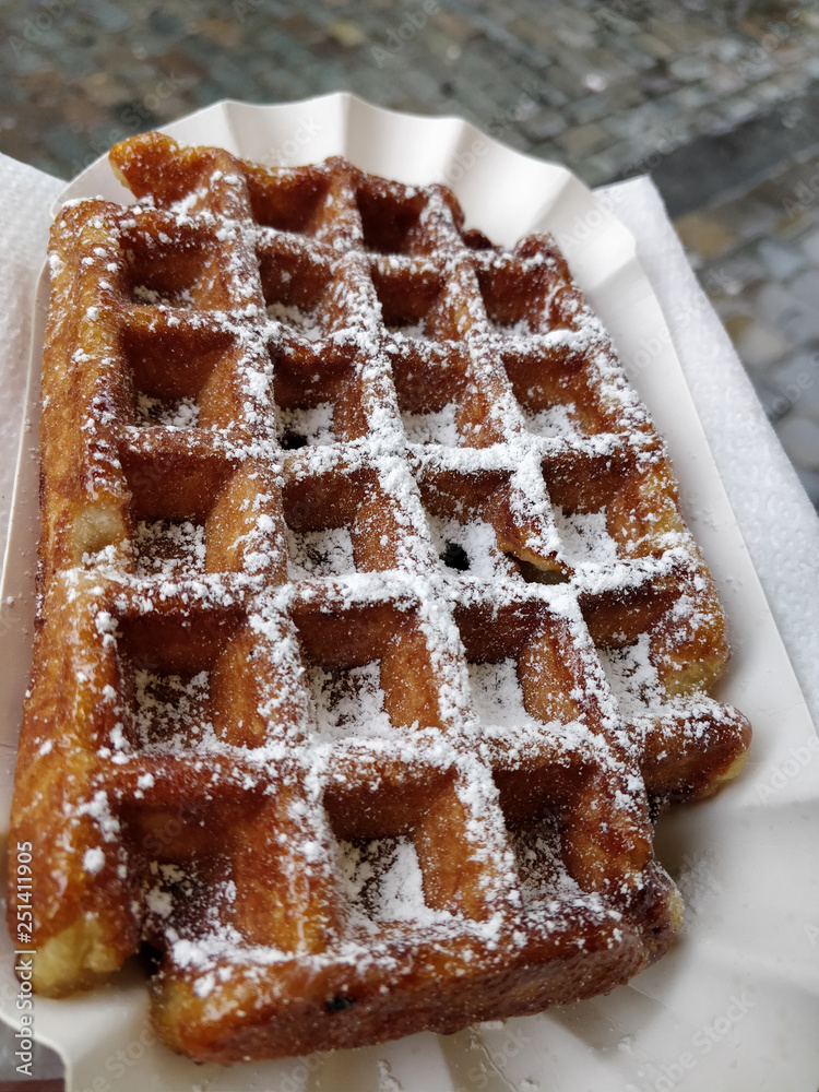 Traditional Belgian pastry food Waffle in the center of Brussels city