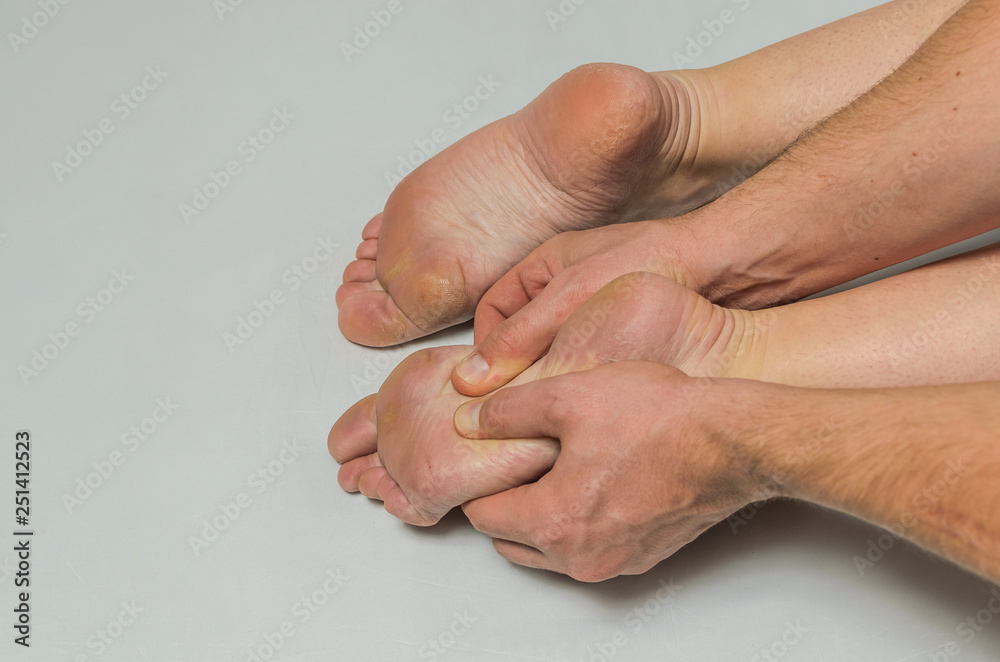 Fototapeta premium Hands massage therapist do foot massage