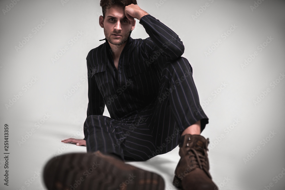 Elegant Young Handsome Man Posing In Fashionable Suit, Looking At Camera.  Studio Shot. Stock Photo, Picture and Royalty Free Image. Image 64308058.