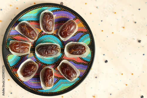Overhead shot of Medjool Dates on a Circular Plate. Colourful Food Mandala photo