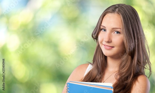 Young Student Girl with backpack and books photo