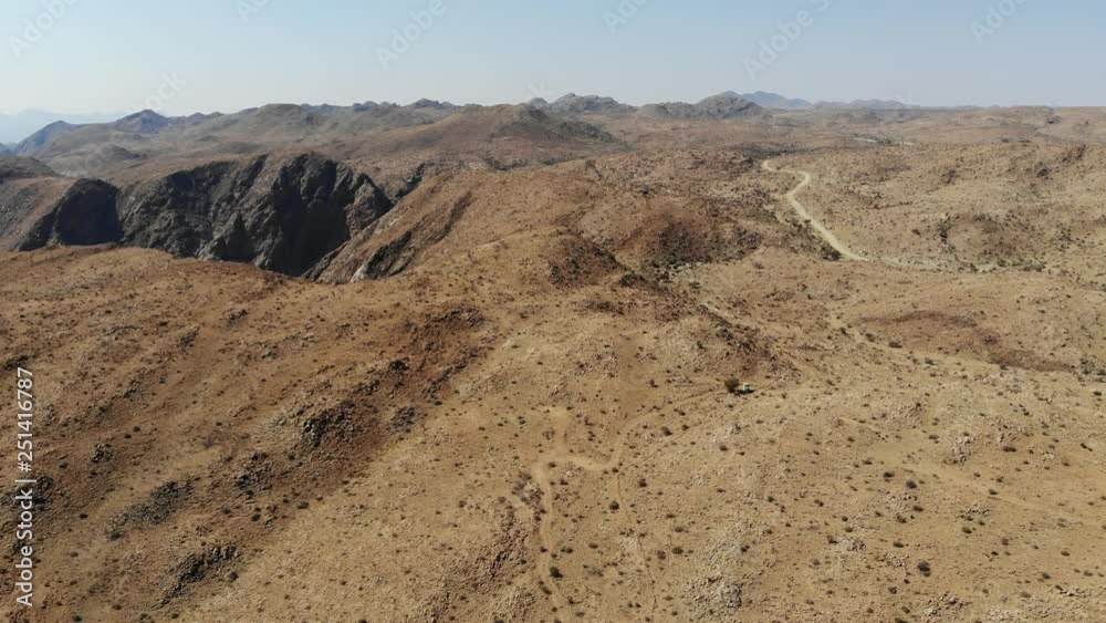 Arid desert landscape of Central Khomas Highland with very steep Spreetshoogte Pass Road in Namibia, Aerial drone shot Arid desert landscape of Central Khomas Highland with very steep Spreetshoogte Pass Road in Namibia, Aerial drone shot