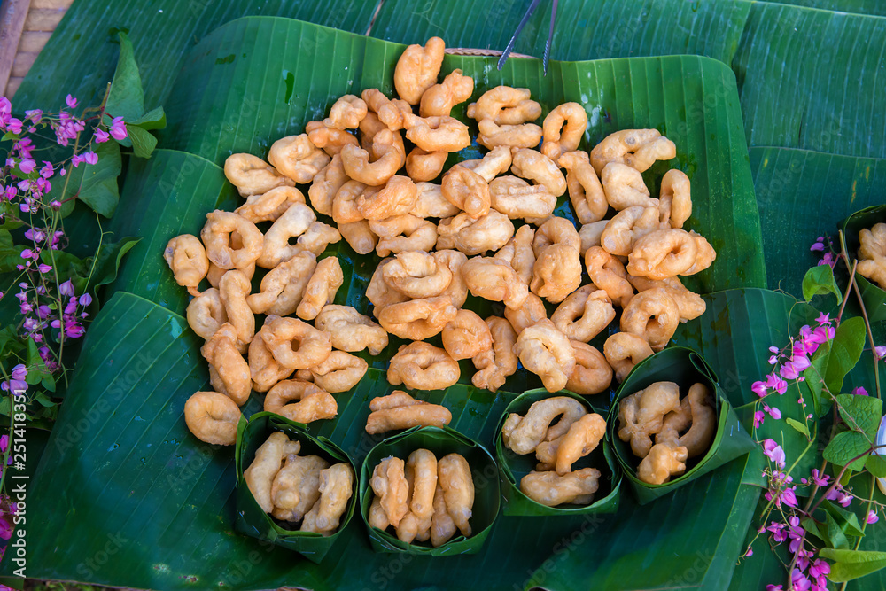Fototapeta premium Delicious Asia, Asian eating food. Frying mini Chinese Churros or Chinese Donut with soy milk for breakfast menu. ( Thai name is Patongko ). Chinese Doughnuts Popular breakfast served with soy milk.