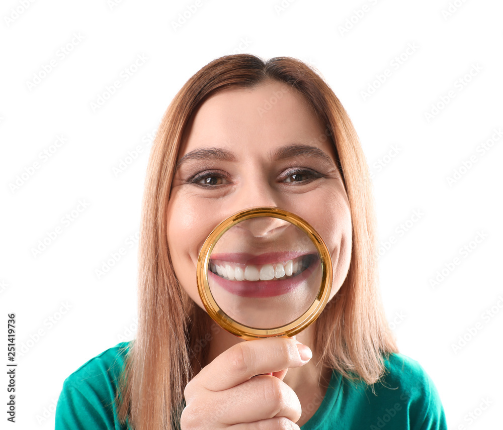 Smiling woman with perfect teeth and magnifier on white background Smiling woman with perfect teeth and magnifier on white background