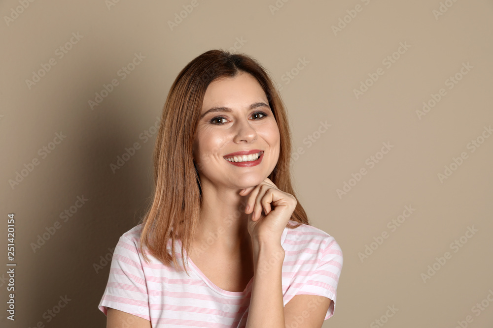 Smiling woman with perfect teeth on color background Smiling woman with perfect teeth on color background