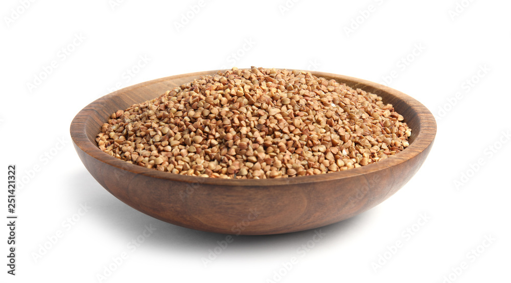 Bowl with uncooked buckwheat on white background Bowl with uncooked buckwheat on white background