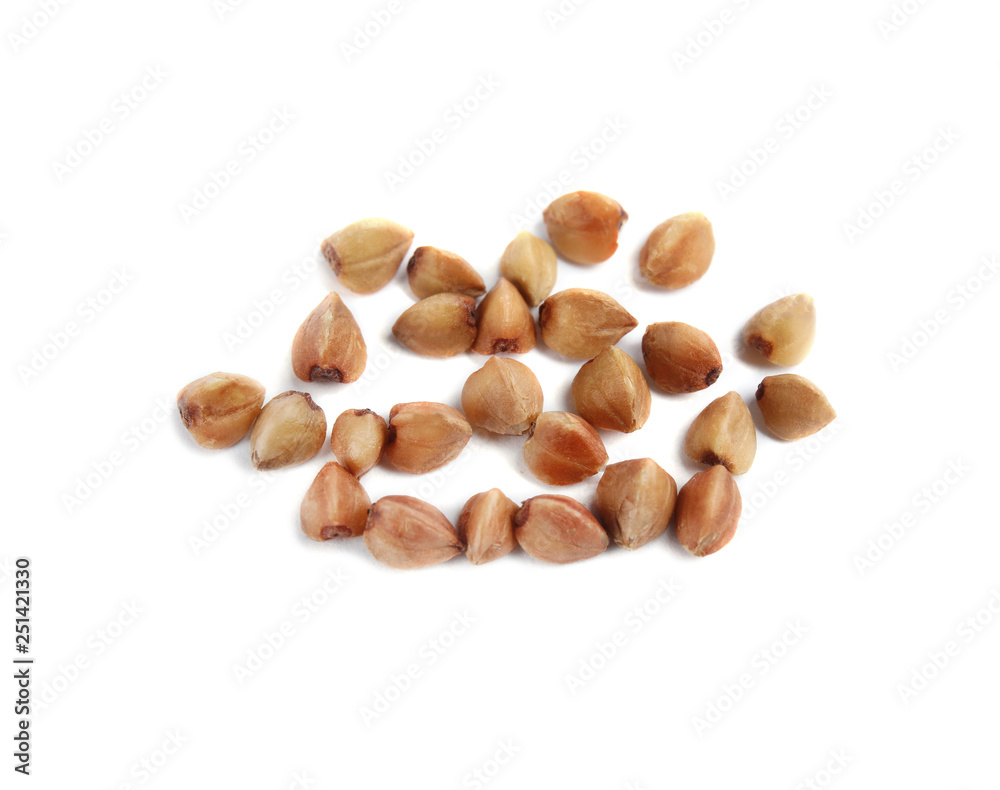 Uncooked buckwheat on white background. Healthy diet Uncooked buckwheat on white background. Healthy diet