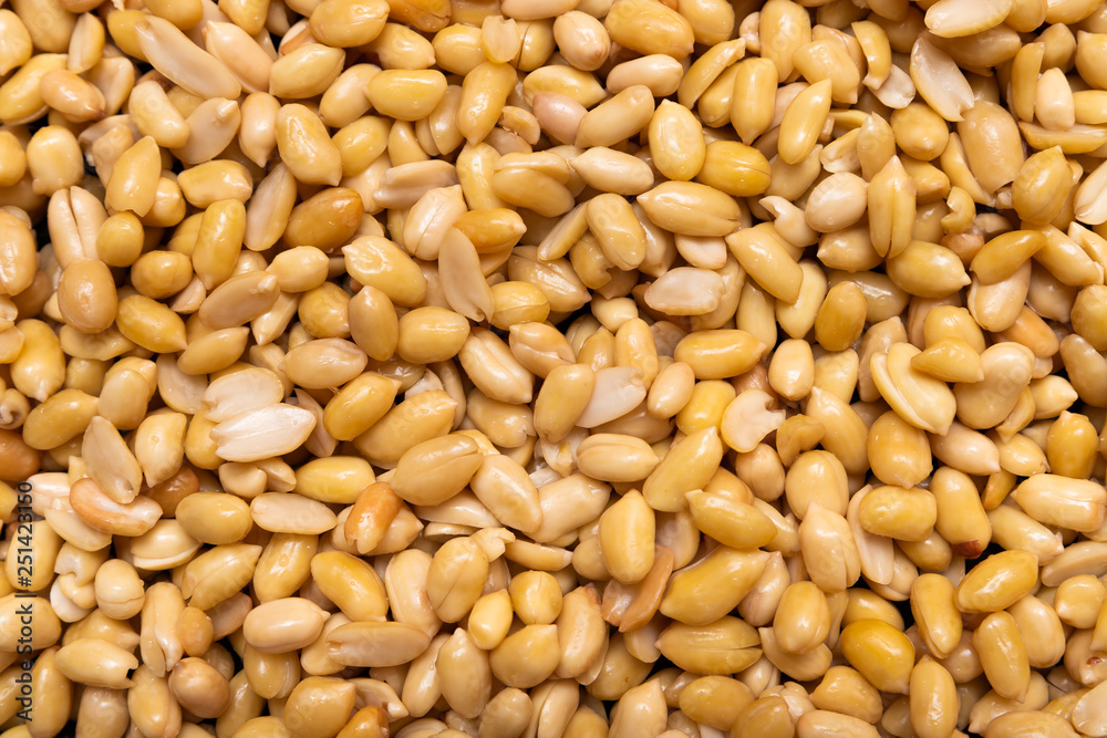 Washed grains of peeled peanuts ready for frying Washed grains of peeled peanuts ready for frying