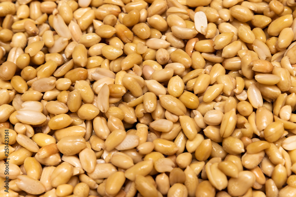 Washed grains of peeled peanuts ready for frying Washed grains of peeled peanuts ready for frying