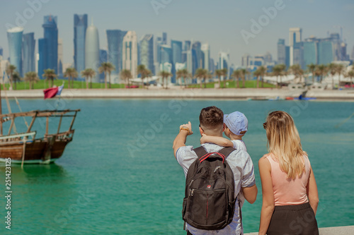 Fotografie tourist european family looks at the skyscrapers West Bay in Doha, Qatar