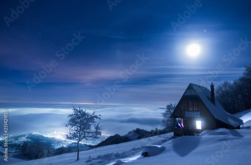 Frozen mountain refuge in Romania on a very cold winter night © Andrei