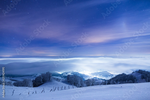 Small city in Romania is covered in fog on a very cold winter night © Andrei
