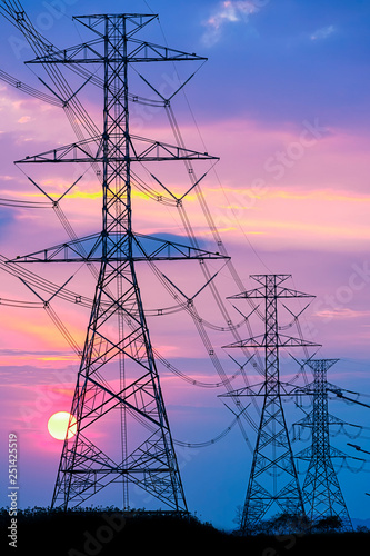 Canvas Print High voltage electricity post and colorful sky on sunrise