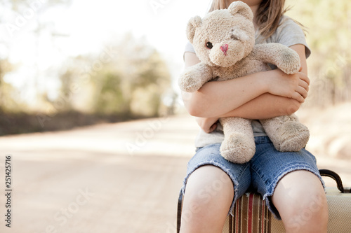 Little Girl with Ragged Teddybear and Suitcase - Poverty, Homelessness, Runaway Child