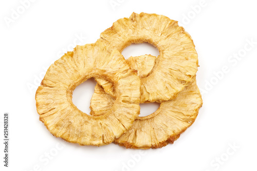 Dried candied pineapple rings, top view, isolated on white background