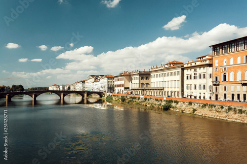 Blue sky over river Arno bridge of ancient Tuscany city Florence. Italian cityscape