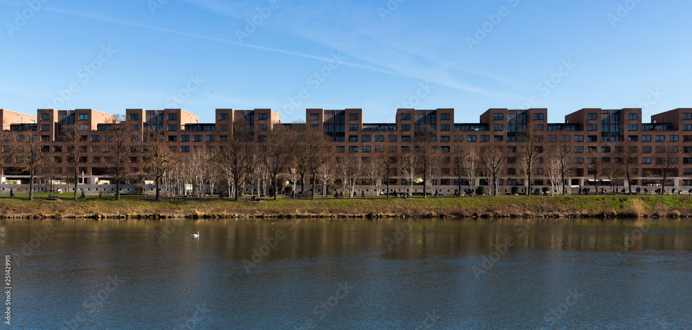 Panorama of River Maas in front of a line of apartments in Maastricht