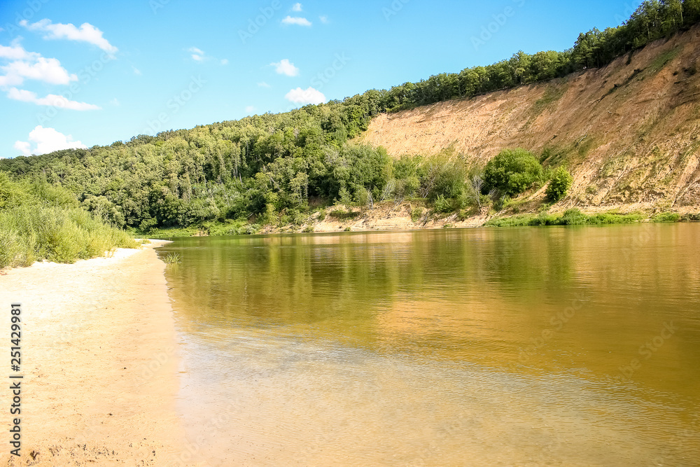 Beautiful summer landscape, sandy beach, river, blue sky