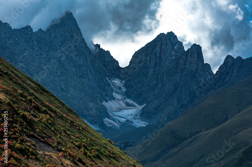 Sharp Roshkakhori mountain peaks in the clouds