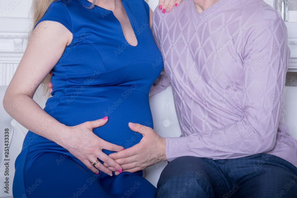 Cropped image of beautiful pregnant woman and her handsome husband. Happy couple announcing pregnancy. Cropped image of beautiful pregnant woman and her handsome husband. Happy couple announcing pregnancy.