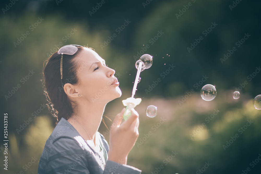 close up. beautiful young woman blowing bubbles