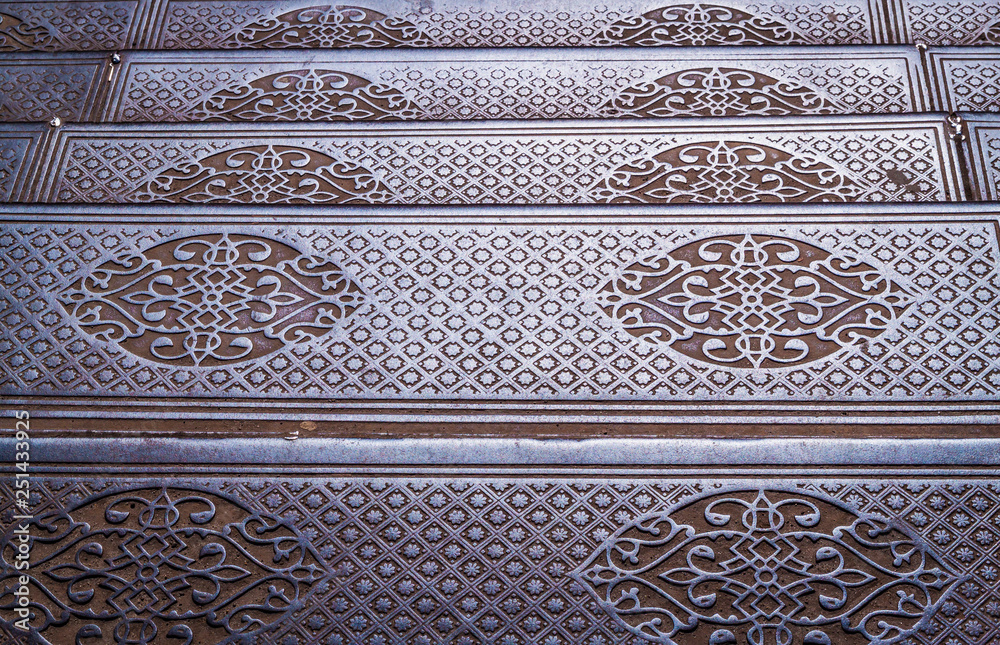 Beautiful pattern on the vintage metal floor steps paving pile outdoors.