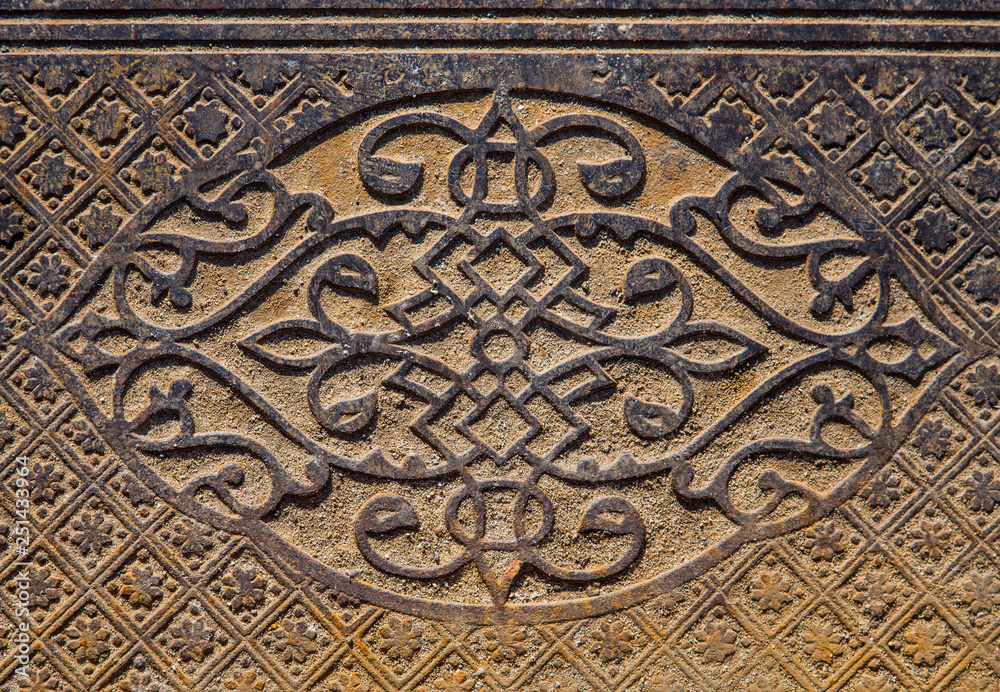 Beautiful pattern on the vintage metal floor paving pile outdoors.