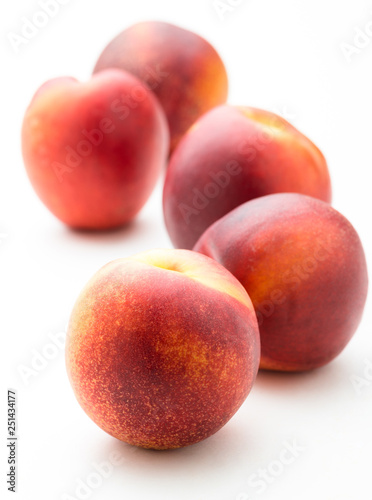 fresh peaches on white
