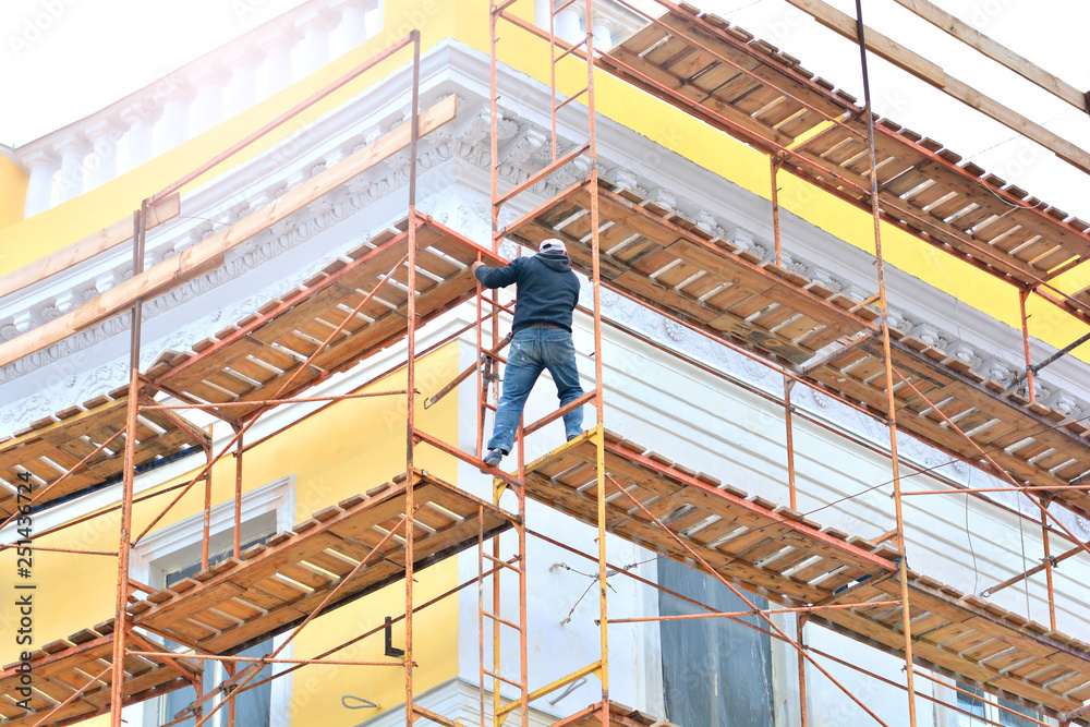 Worker on a building facade restoration