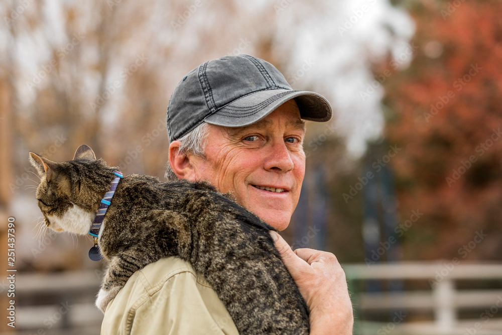 Senior man holding cat Senior man holding cat