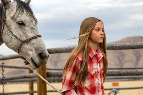 Girl leading horse