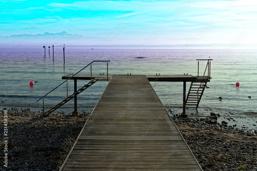 Fototapeta premium Boat dock on Lake Constance with a view of the Alps