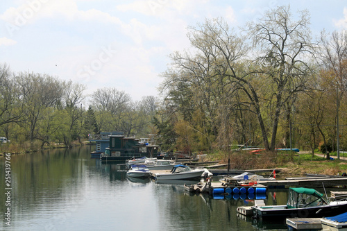 Boats and Houseboats in a Channel