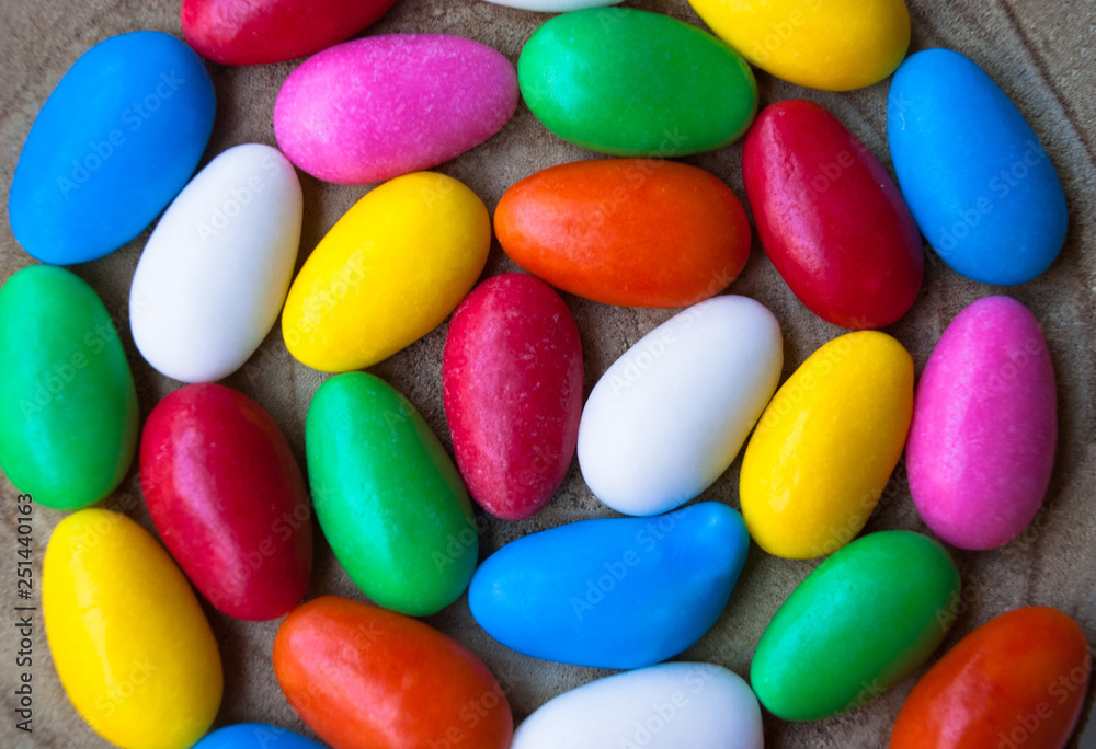Easter background with colorful glazed candy eggs Easter background with colorful glazed candy eggs