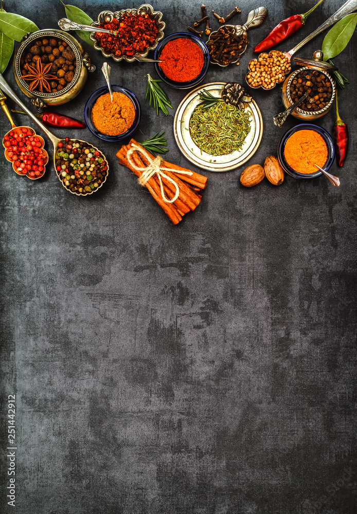 Various spices spoons on stone table. Top view . Various spices spoons on stone table. Top view .