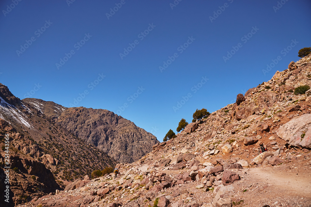 View of red Moroccan mountains of Atlas on the touristic path to Jebel Toubkal