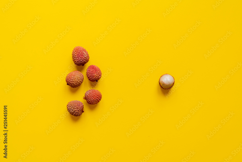 fresh lychees on yellow background isolated text mockup b fresh lychees on yellow background isolated text mockup b