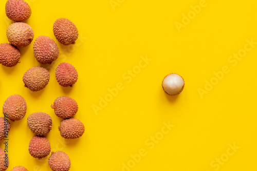 fresh lychees on yellow background isolated text mockup b photo