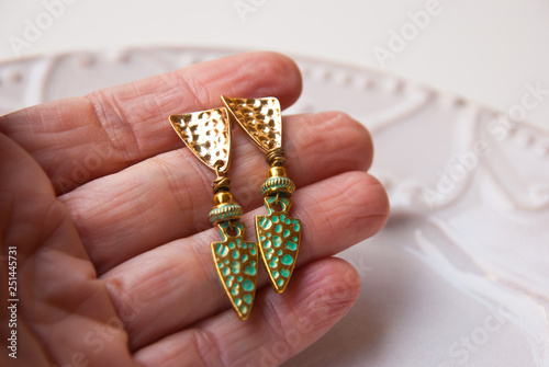 Metal gold turquoise earrings. Fashion luxury accessory jewellery.