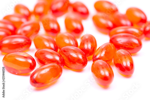 Docusate sodium (dioctyl sodium sulfosuccinate) red soft gel capsules isolated on white background. photo