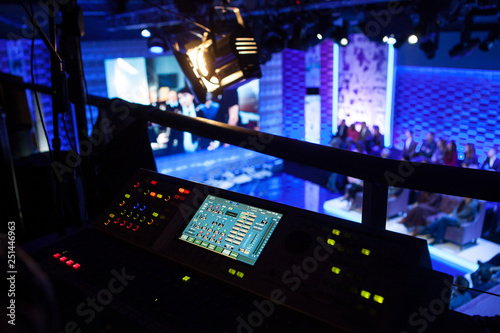 Photo Backstage from the side of the mixing console in the television studio, the work