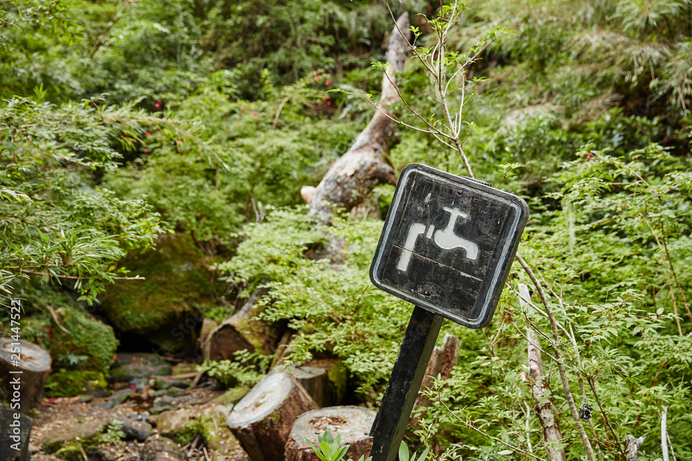 Chile, Los Sauces, Nahuelbuta National Park, spring with sign Chile, Los Sauces, Nahuelbuta National Park, spring with sign