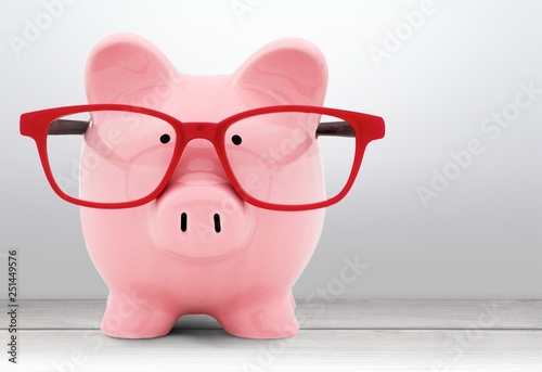 Piggy bank in glasses