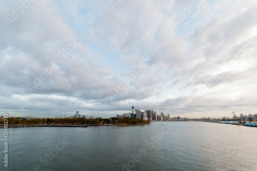View of dramatic clouds over New York city skyline and upper Hudson River in morning from Brooklyn Cruise Terminal  © PNPImages