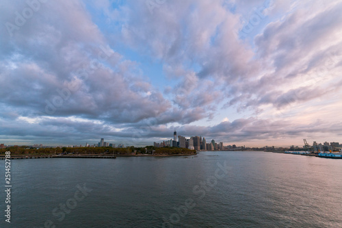 View of dramatic clouds over New York city skyline and upper Hudson River in morning from Brooklyn Cruise Terminal  © PNPImages