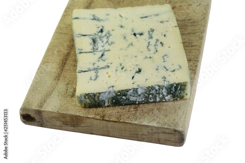 piece of danish blue cheese on a wooden board  photo