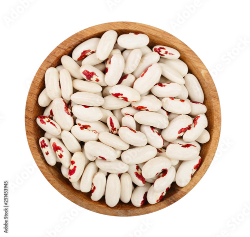 variegated kidney bean in wooden spoon isolated on white background. Top view. Flat lay