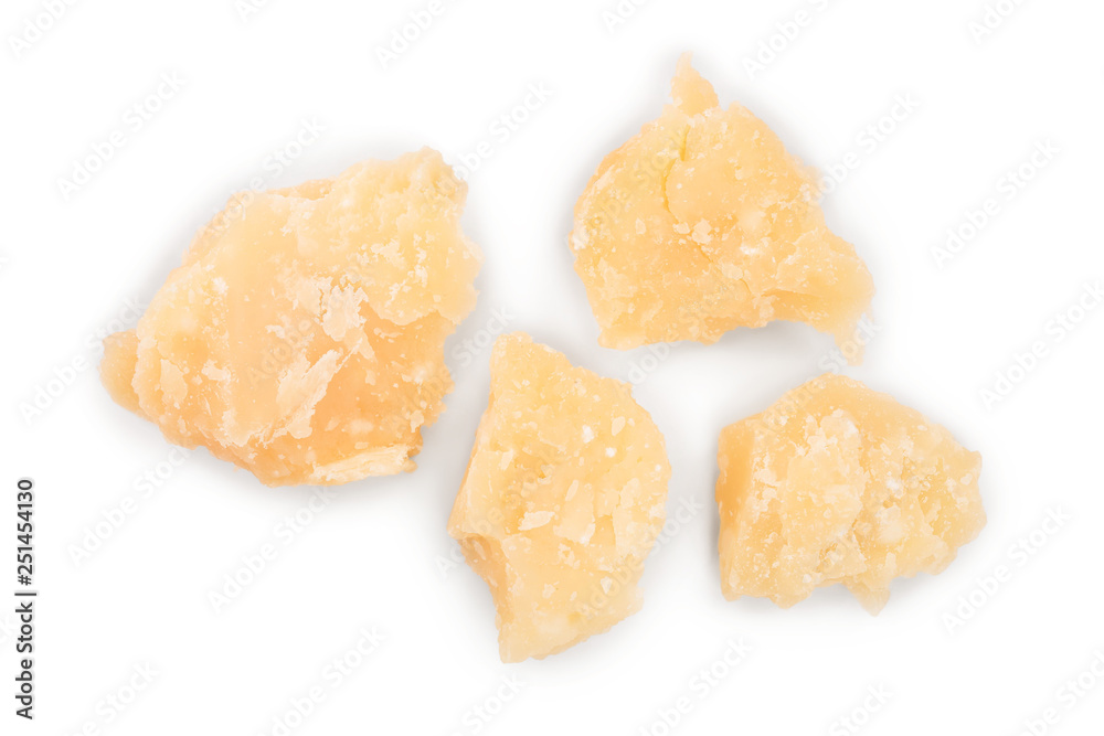 Parmesan cheese pieces isolated on white background. Closeup. Top view. Flat lay Parmesan cheese pieces isolated on white background. Closeup. Top view. Flat lay