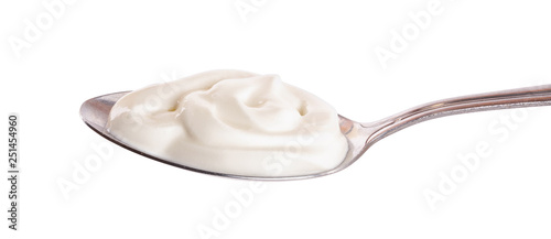 Photography Sour cream in metal spoon isolated on white background