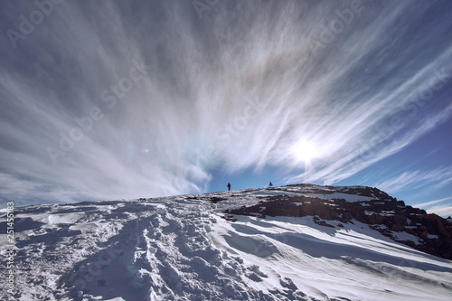 Reaching the snow covered top of Jebel Toubkal mountain in High Atlas Morocco